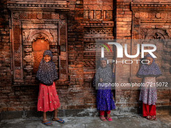 Children pose for a photo in front of Khaniadighi Masjid mosque in chapainawabganj, Bangladesh. (