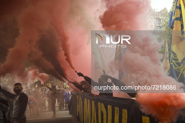 Veterans of Russian-Ukrainian war , activists and supporters of Ukraine's nationalist movements,  burn smoke grenades during a procession to...