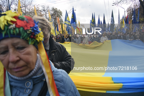 Veterans of Russian-Ukrainian war , activists and supporters of Ukraine's nationalist movements,  take part in a procession to mark the Defe...