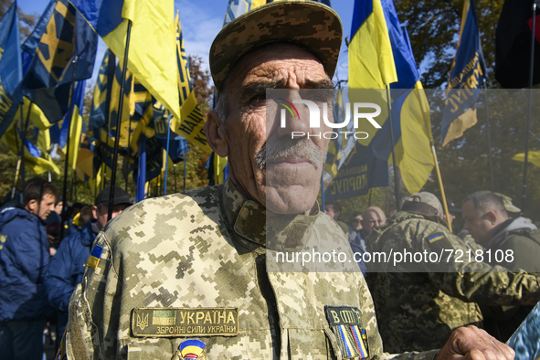 Veterans of Russian-Ukrainian war , activists and supporters of Ukraine's nationalist movements,  take part in a procession to mark the Defe...