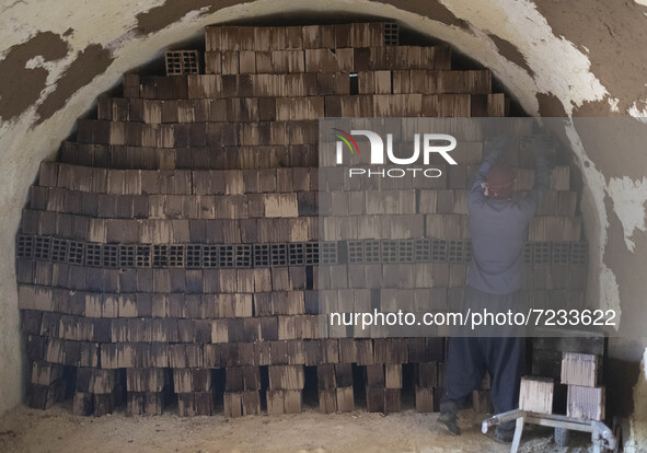 An Afghan refugee labor works in a brick factory, in the Borkhar area in the west of the city of Isfahan 439Km (273 Miles) southern Tehran o...