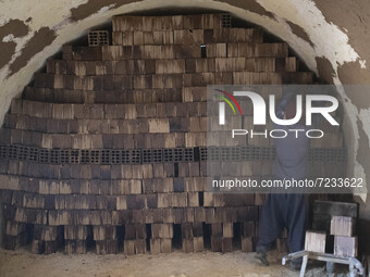 An Afghan refugee labor works in a brick factory, in the Borkhar area in the west of the city of Isfahan 439Km (273 Miles) southern Tehran o...