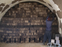 An Afghan refugee labor works in a brick factory, in the Borkhar area in the west of the city of Isfahan 439Km (273 Miles) southern Tehran o...