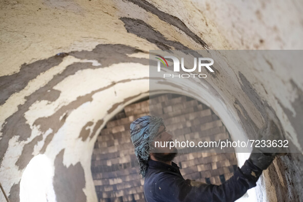 An Afghan refugee labor works in a brick factory, in the Borkhar area in the west of the city of Isfahan 439Km (273 Miles) southern Tehran o...