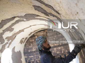 An Afghan refugee labor works in a brick factory, in the Borkhar area in the west of the city of Isfahan 439Km (273 Miles) southern Tehran o...