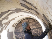 An Afghan refugee labor works in a brick factory, in the Borkhar area in the west of the city of Isfahan 439Km (273 Miles) southern Tehran o...