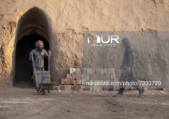 Two Afghan refugee laborers work in a brick factory, in the Borkhar area in the west of the city of Isfahan 439Km (273 Miles) southern Tehra...