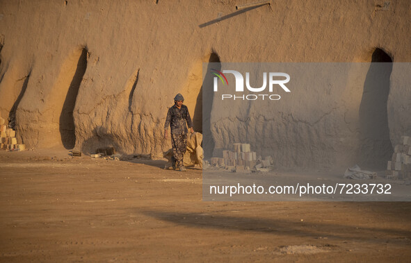 An Afghan refugee labor works in a brick factory, in the Borkhar area in the west of the city of Isfahan 439Km (273 Miles) southern Tehran o...