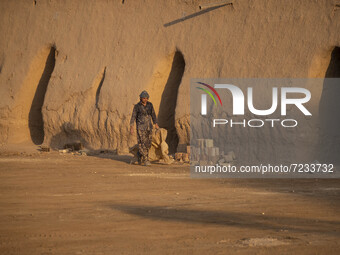 An Afghan refugee labor works in a brick factory, in the Borkhar area in the west of the city of Isfahan 439Km (273 Miles) southern Tehran o...