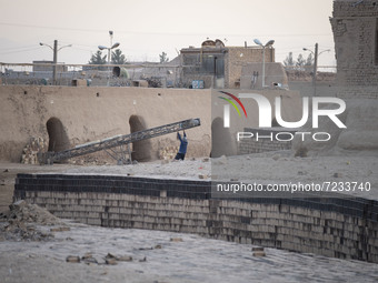 An Afghan refugee labor works in a brick factory, in the Borkhar area in the west of the city of Isfahan 439Km (273 Miles) southern Tehran o...