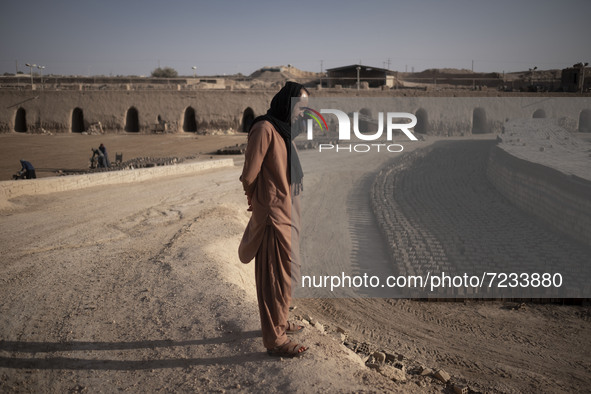 An Afghan refugee labor looks on as he stands in a brick factory, in the Borkhar area in the west of the city of Isfahan 439Km (273 Miles) s...