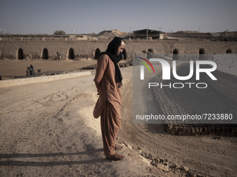 An Afghan refugee labor looks on as he stands in a brick factory, in the Borkhar area in the west of the city of Isfahan 439Km (273 Miles) s...