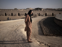 An Afghan refugee labor looks on as he stands in a brick factory, in the Borkhar area in the west of the city of Isfahan 439Km (273 Miles) s...