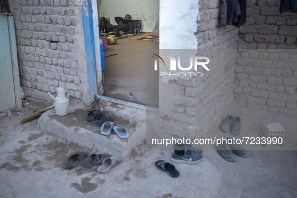 A Sunni-Afghan refugee labor rest at his hut which is shared with five other Afghan laborers in a brick factory after a working day in the B...