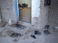 A Sunni-Afghan refugee labor rest at his hut which is shared with five other Afghan laborers in a brick factory after a working day in the B...