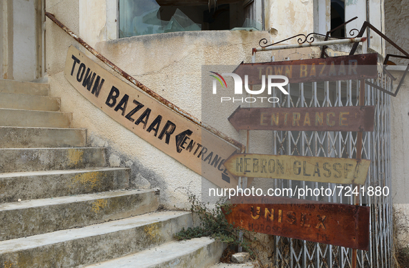 Old signs on abandoned buildings, fenced off by the Turkish military since 1974, in the abandoned coastal area of Varosha, a suburb of the c...