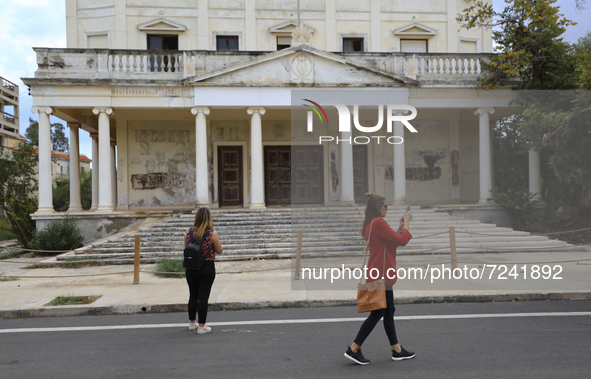 Women walk through territory fenced off by the Turkish military since 1974 in the abandoned coastal area of Varosha, a suburb of the city of...