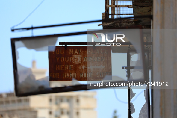 An old sign on an abandoned building, fenced off by the Turkish military since 1974, in the abandoned coastal area of Varosha, a suburb of t...