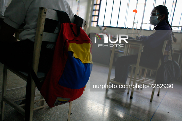 A girl looks at the blackboard during the start of face-to-face classes at all levels amidst the Coronavirus pandemic in Caracas, Venezuela...