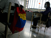 A girl looks at the blackboard during the start of face-to-face classes at all levels amidst the Coronavirus pandemic in Caracas, Venezuela...