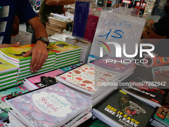 A vendor arranges notebooks at a school fair in the midst of the Coronavirus pandemic in Caracas, Venezuela October 25, 2021. (