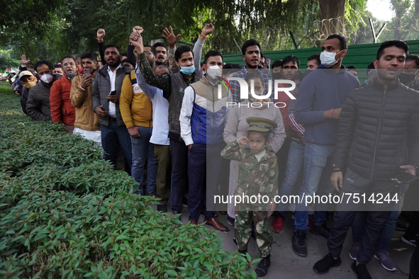 People queue up outside the residence of India's Chief of Defence Staff General Bipin Rawat, who died in a helicopter crash, to pay their la...