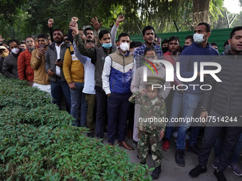 People queue up outside the residence of India's Chief of Defence Staff General Bipin Rawat, who died in a helicopter crash, to pay their la...