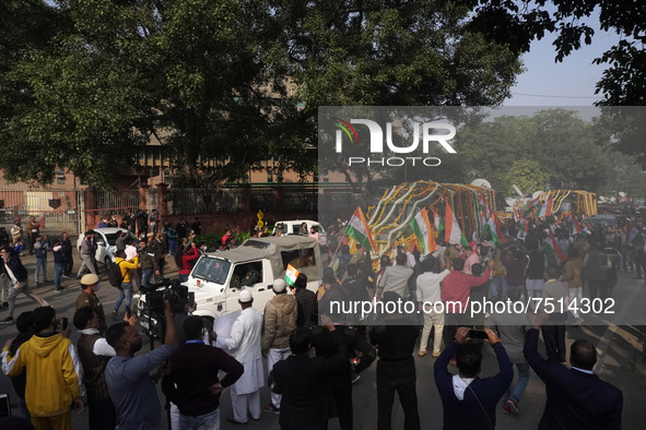 Officials and armed force personnel escort the vehicle covered with flowers carrying the casket of India's Chief of Defence Staff General Bi...