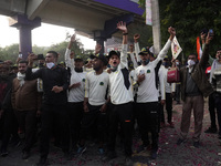 People gather near Brar Square in Delhi cantonment, where India's Chief of Defence Staff General Bipin Rawat will be cremated with full mili...