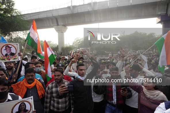 People gather near Brar Square in Delhi cantonment, where India's Chief of Defence Staff General Bipin Rawat will be cremated with full mili...