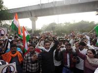 People gather near Brar Square in Delhi cantonment, where India's Chief of Defence Staff General Bipin Rawat will be cremated with full mili...