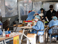 Medical workers test swab samples at a COVID-19 testing facility during the Omicron Variant wave of the Coronavirus pandemic on February 09,...