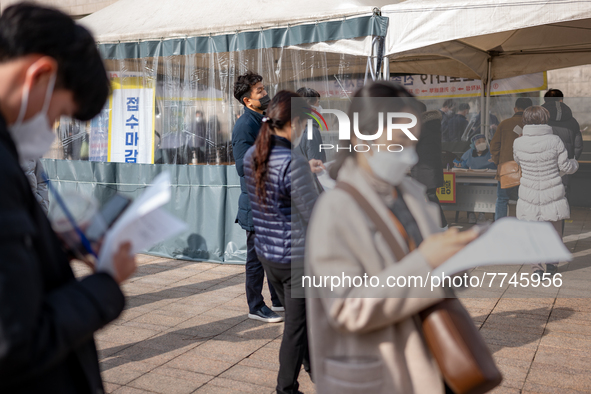 Citizens wait for the results of the COVID-19 test in front of Seoul Metropolitan Government Hall on February 9, 2022 in Seoul, South Korea....