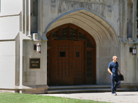 Student outside Dillon Hall at the Assumption College building of the University of Windsor in Ontario, Canada. (