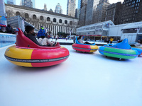 People ride ice-bumper cars at The Rink at Bank of America Winter Village at Bryant Park on February 10, 2022 in New York City. Despite a re...