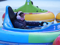 People ride ice-bumper cars at The Rink at Bank of America Winter Village at Bryant Park on February 10, 2022 in New York City. Despite a re...