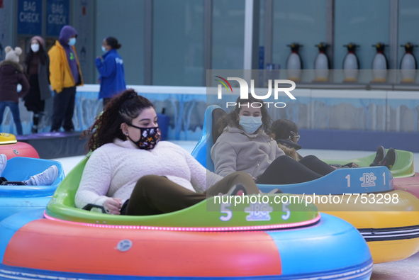 People ride ice-bumper cars at The Rink at Bank of America Winter Village at Bryant Park on February 10, 2022 in New York City. Despite a re...