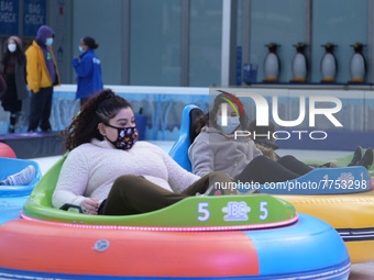 People ride ice-bumper cars at The Rink at Bank of America Winter Village at Bryant Park on February 10, 2022 in New York City. Despite a re...