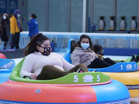 People ride ice-bumper cars at The Rink at Bank of America Winter Village at Bryant Park on February 10, 2022 in New York City. Despite a re...