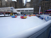 People ride ice-bumper cars at The Rink at Bank of America Winter Village at Bryant Park on February 10, 2022 in New York City. Despite a re...