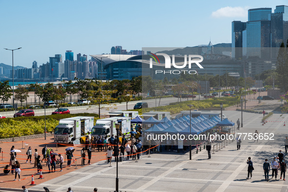 People queue up at an open air testing ground at Endinburgh Place in Central Hong Kong, China, on February 11, 2022.    