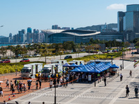 People queue up at an open air testing ground at Endinburgh Place in Central Hong Kong, China, on February 11, 2022.    (