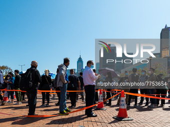 People queue up at an open air testing ground at Endinburgh Place in Central Hong Kong, China, on February 11, 2022.    (