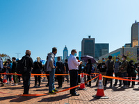 People queue up at an open air testing ground at Endinburgh Place in Central Hong Kong, China, on February 11, 2022.    (