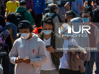 People queue at a temporary COVID test centre in Edinburgh Place in Central Hong Kong, China, on February 11, 2022.        (