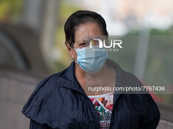 A woman wearing a face mask walks in Santa Cruz de Tenerife on 13 February 2022. 