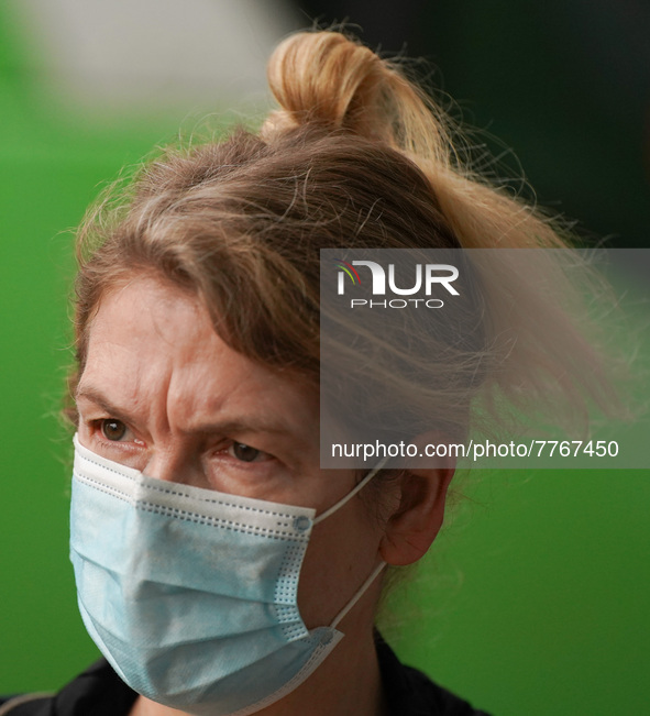 A woman wears a face mask as she walks in Santa Cruz de Tenerife on 13 February 2022. 