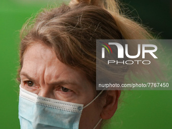 A woman wears a face mask as she walks in Santa Cruz de Tenerife on 13 February 2022. (