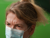 A woman wears a face mask as she walks in Santa Cruz de Tenerife on 13 February 2022. (