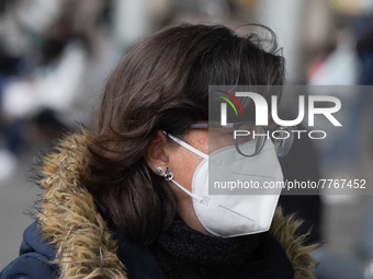 A woman wearing a face masks walks in Santa Cruz de Tenerife on 13 February 2022 (